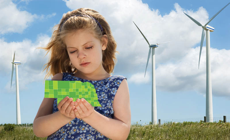 public power, girl standing in front of wind turbines