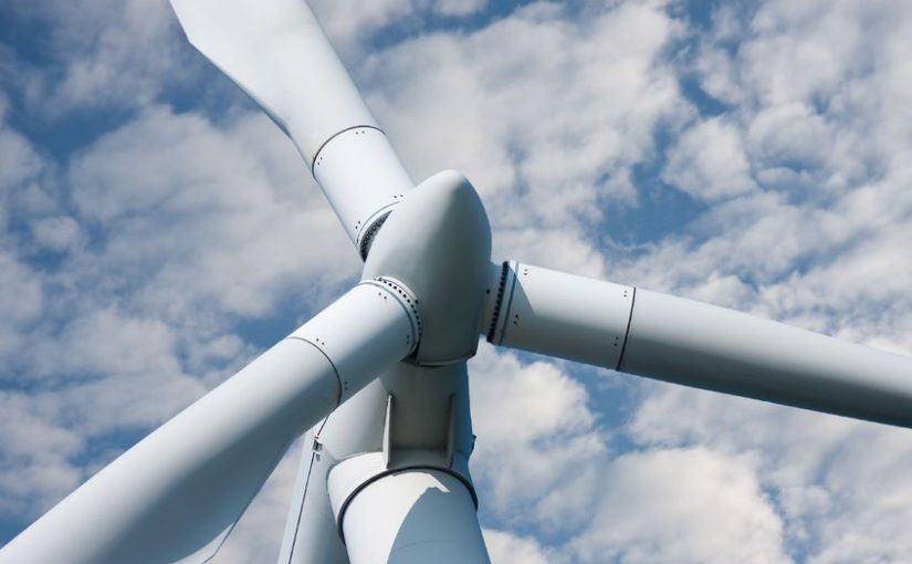 5867630 – closeup of a huge windmill against a cloudy sky