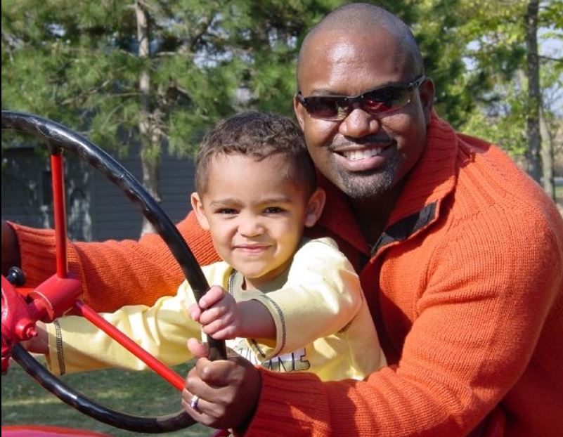 Wyndle and son on tractor