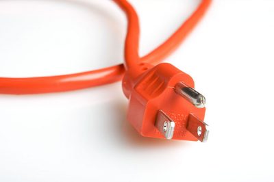 11945765 – close up of an orange power plug