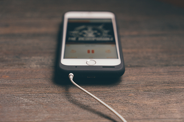 cellphone charging on a table, prepare for a power outage