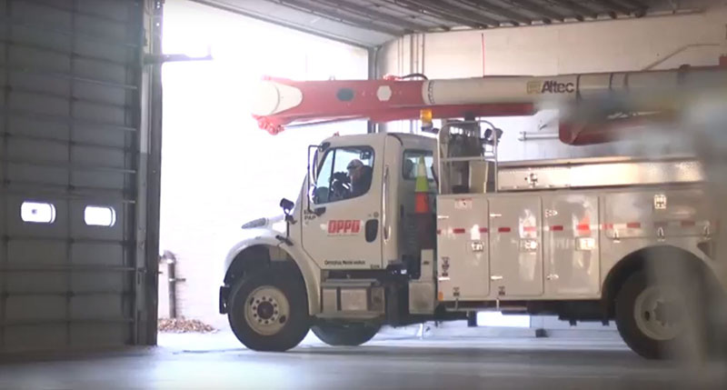 Utility truck departs from a garage at OPPD. June, 2018. Front-line employees