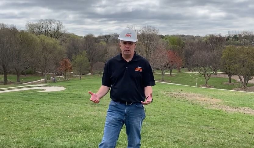 OPPD forester standing in green space at OPPD arboretum, April 2021 Arbor Day tree tips